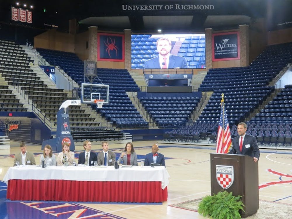 <p>Rob Andrejewski addresses the crowd during the panel discussion between state officials and student representatives at the Robins Center.</p>