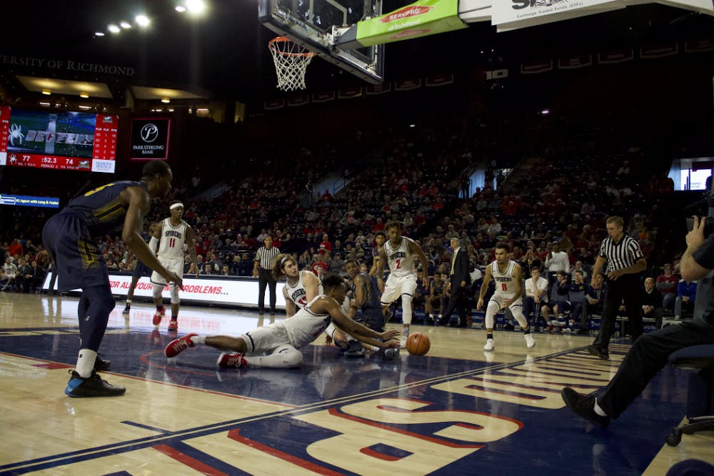 <p>Nick Sherod scrambles to get possession during a win against the La Salle Explorers, 81-74, on Saturday, Jan. 20, 2018. &nbsp;</p>