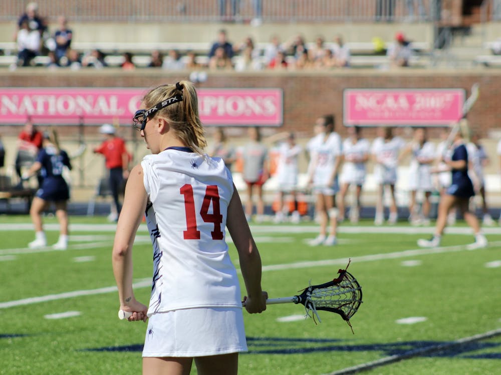 Senior midfielder Marina Miller stands on the side of the field at the Feb. 12 game against Old Dominion University in the Robins Stadium.