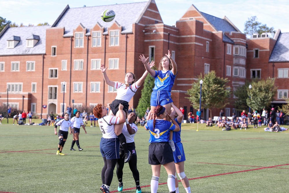 Sophomore Sophia Dimotsi is lifted up by her teammates during a line out in the Widows' game against Emory and Henry College.