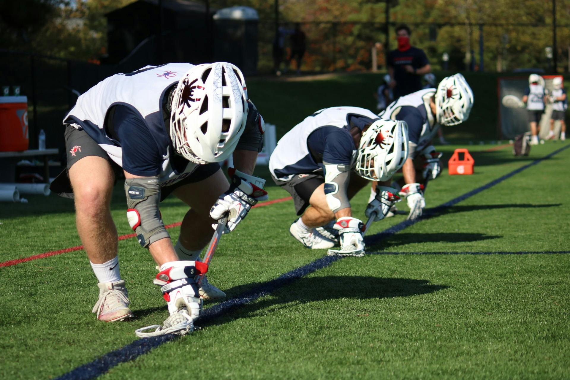 Players on the University of Richmond men's lacrosse team prepare for practice.