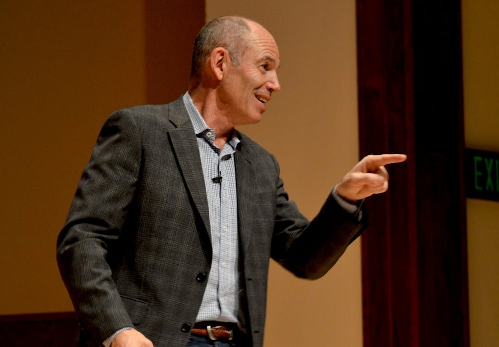 <p>Marc Randolph answers a question from a member in the audience.</p>