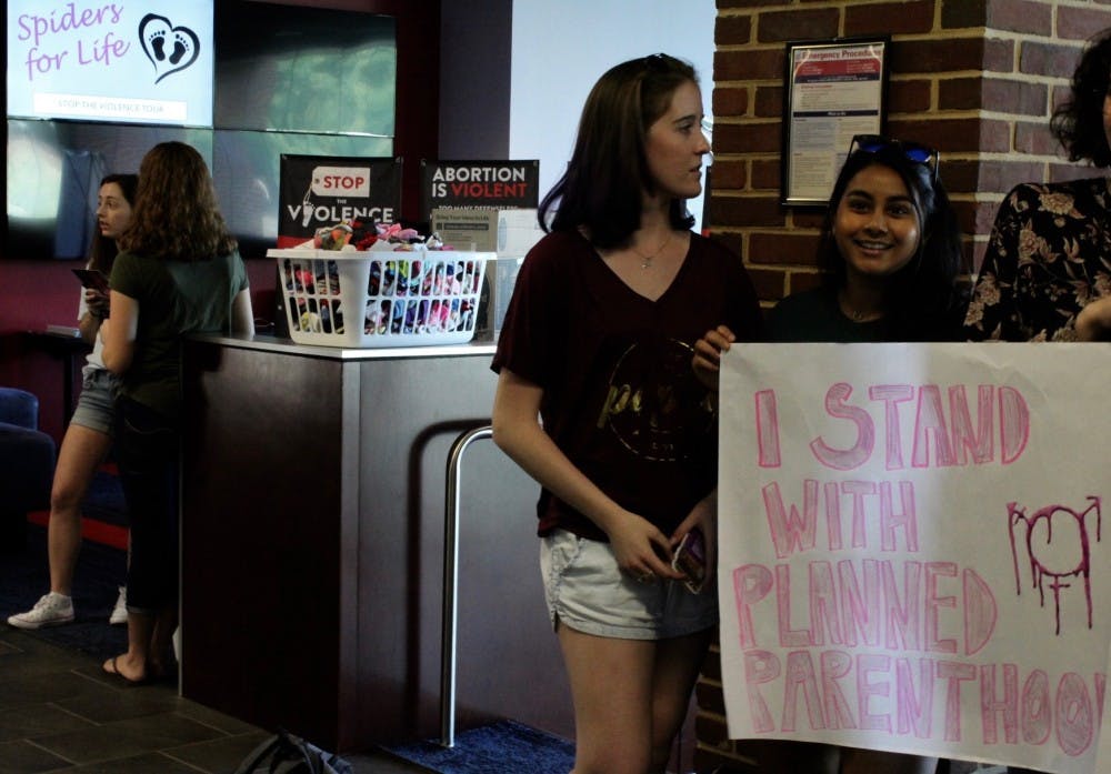 <p>Lillian Sullivan, WC'20, and Nimisha Bangalore, WC'20, protest Spiders for Life, an anti-abortion group on campus.&nbsp;</p>