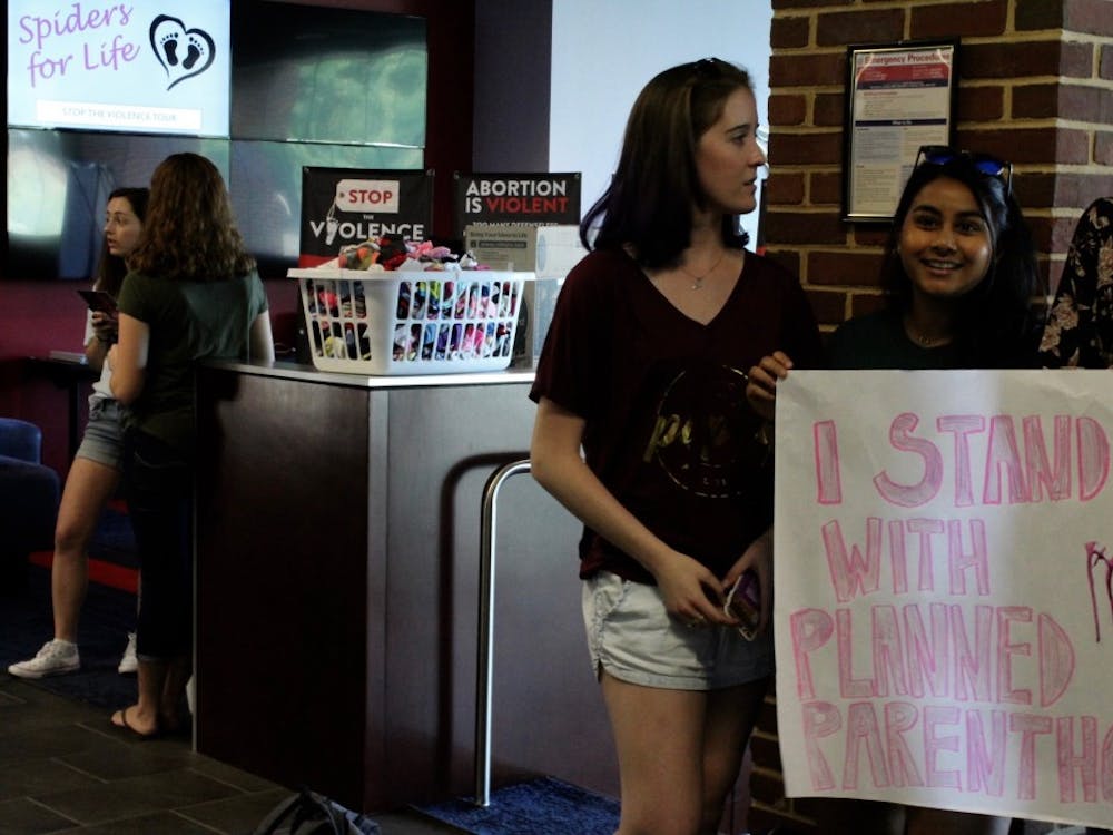 Lillian Sullivan, WC'20, and Nimisha Bangalore, WC'20, protest Spiders for Life, an anti-abortion group on campus.&nbsp;