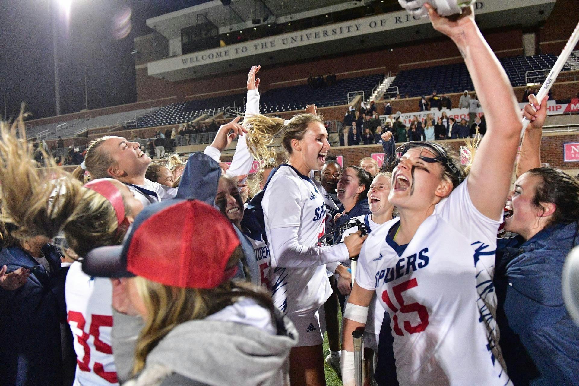 Women’s lacrosse team celebrates win over No. 10 University of Virginia at the E. Claiborne Robins Stadium on March 15.&nbsp;