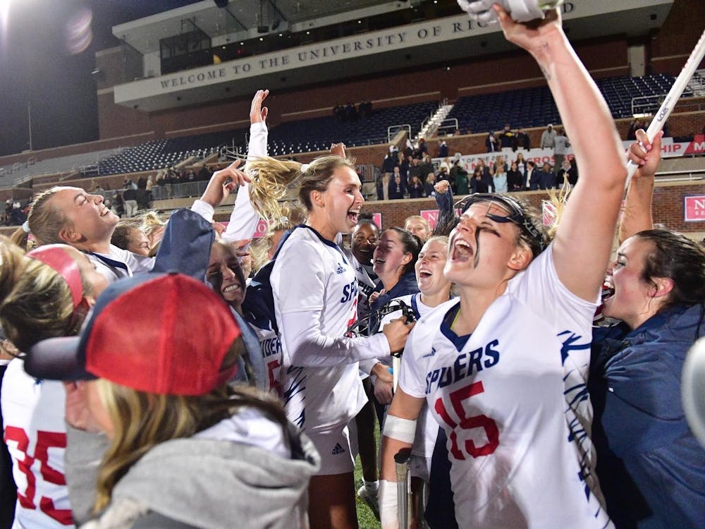 Women’s lacrosse team celebrates win over No. 10 University of Virginia at the E. Claiborne Robins Stadium on March 15.&nbsp;