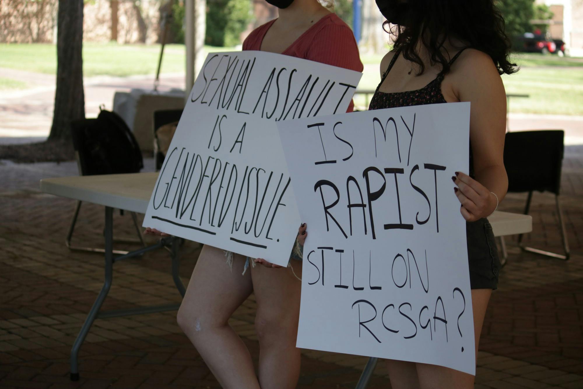 Students gathered on the Forum on April 22 to protest rape culture on campus. The silent protest was organized by junior Hoor Ain as a continuation of events regarding sexual assault in the past month. Students wore masks and held signs supporting free speech. In the silence, a prospective student on a tour passing by asked, "Oh, does rape happen a lot here?" Photos by Madyson Fitzgerald.