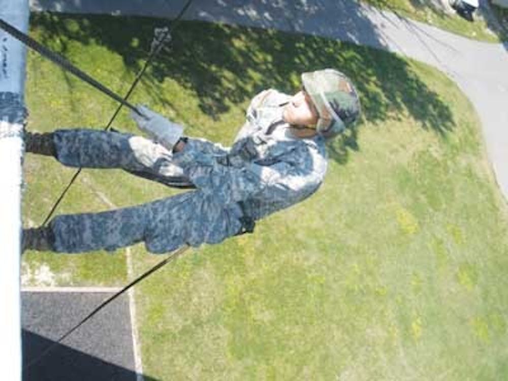 University of Richmond sophomore Brad Praskach scales a 50-foot Rappel Wall at Fort Lee during the Reserve Officers' Training Corps Leadership Lab in Norfolk, Va.