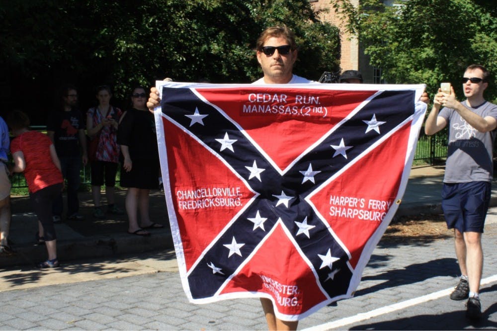 After the Tennessee group left at 10:45 a.m., a man carrying a Confederate flag walked to the front of the crowd. Police soon created a barrier to protect him.&nbsp;