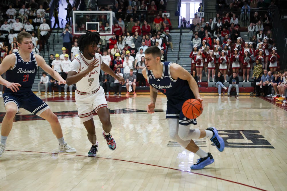 Graduate forward Dusan Neskovic dribbling to the basket in UR's loss to Saint Joseph's University. Courtesy of Richmond Athletics