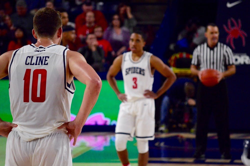 <p>Richmond forward T.J. Cline waits for the game to restart after a timeout as guard ShawnDre' Jones stands on the other side of the court.&nbsp;</p>