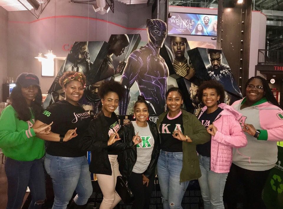 The Refined Roses of the Rho Mu chapter of Alpha Kappa Alpha Sorority, Inc., pose for the free Black Panther screening sponsored by the office of multicultural affairs. Photo courtesy of Davina Adderley&nbsp;
