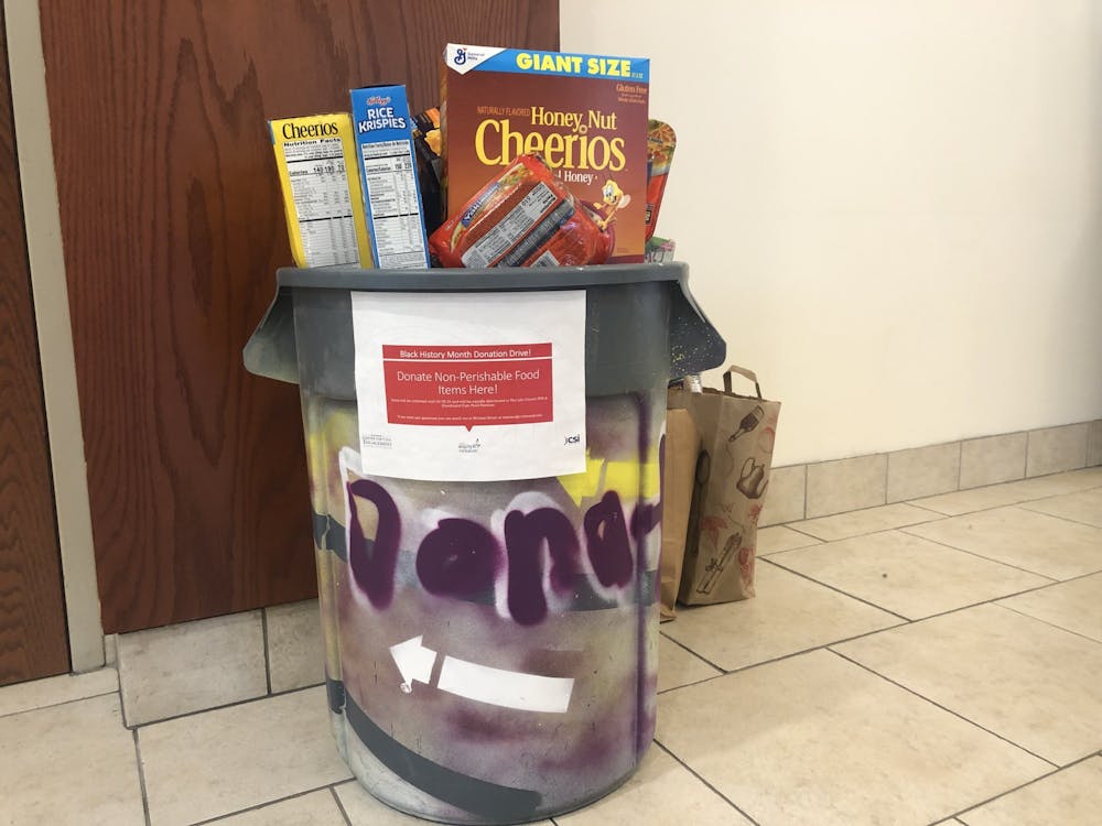 <p>A bin full of non perishable food outside of Everything Convenience for the Black History Month donation drive.&nbsp;</p>