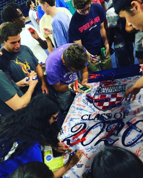 The freshmen class signs their 2020 banner during orientation.Photo courtesy of Instagram/University of Richmond