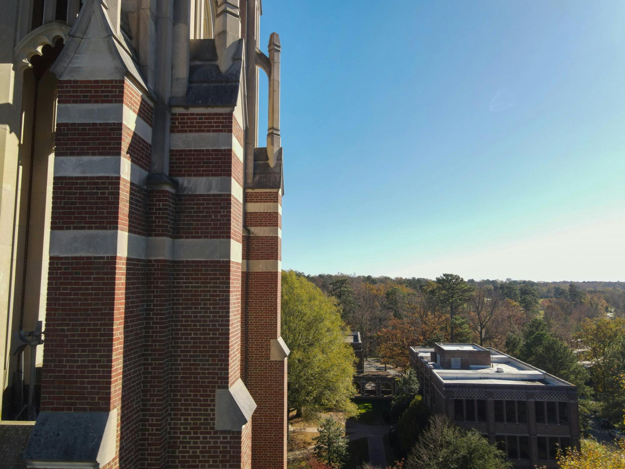 The tower at Boatwright Memorial Library gases over at near Puryear Hall.