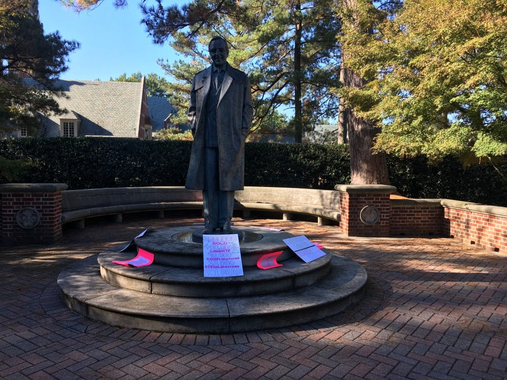 <p>Members of Planned Parenthood Generation Action placed posters on the E.Claiborne Robins statue on October 19, 2017 as part of a demonstration.</p>