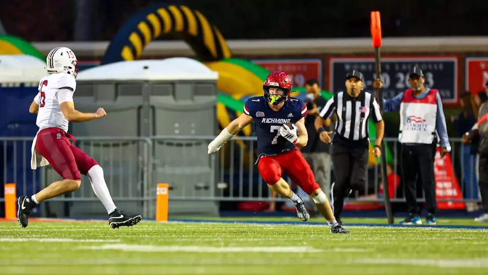<p>Running back Jamaal Brown charges with ball during final home game against Lafayette college. Courtesy of Spider Athletics.</p>