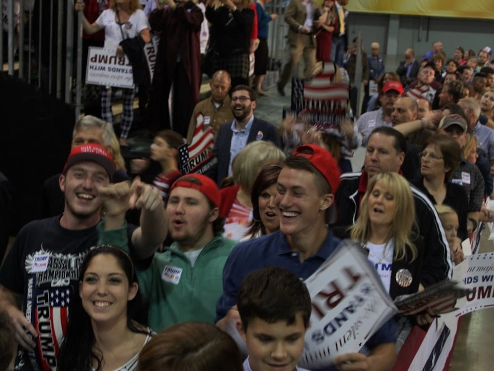 Young Trump supporters walk around at a rally in Richmond last year.&nbsp;