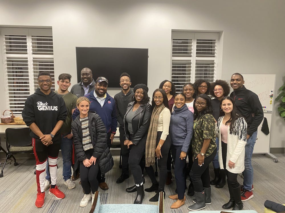 <p>Current students and alumni pose for a photo at BSA's “Untold Stories: Voices of Black Alumni” panel event. The event took place on Monday, Feb. 10, 2020.&nbsp;</p>