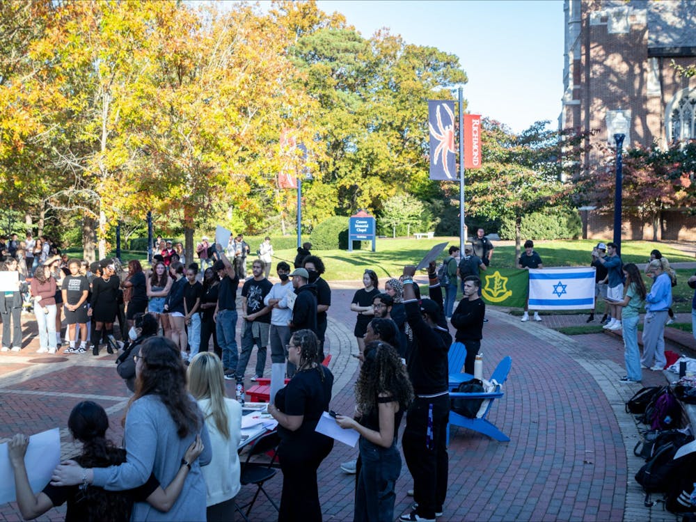 Spiders Against Apartheid demonstration takes place Oct. 25 with counter-protesters and University of Richmond Police Department standing outside the demonstration. &nbsp;