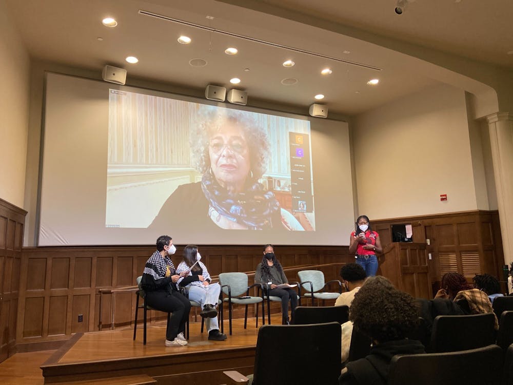 <p>Angela Davis discusses Palestinian and Black struggle at a lecture in the Ukrop Auditorium on Nov. 14. From left to right senior Razan Khalil, junior Sarah Salah, sophomore Christian Herald and senior Simone Reid moderated the event.</p>