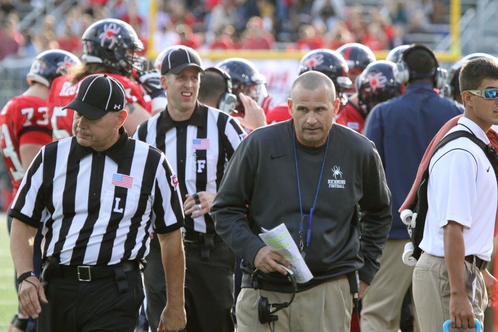 <p>Coach Danny Rocco stands on the sidelines during a Richmond victory.&nbsp;</p>