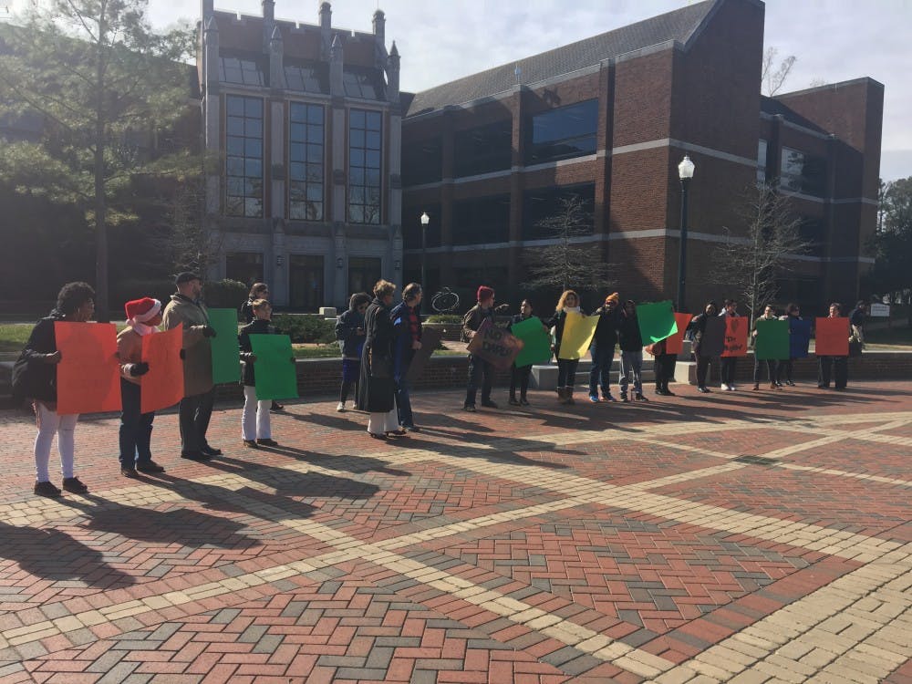 About 25 Richmond&nbsp;students, faculty and staff marched on the university forum Friday morning in solidarity against President Trump's recent executive orders.
