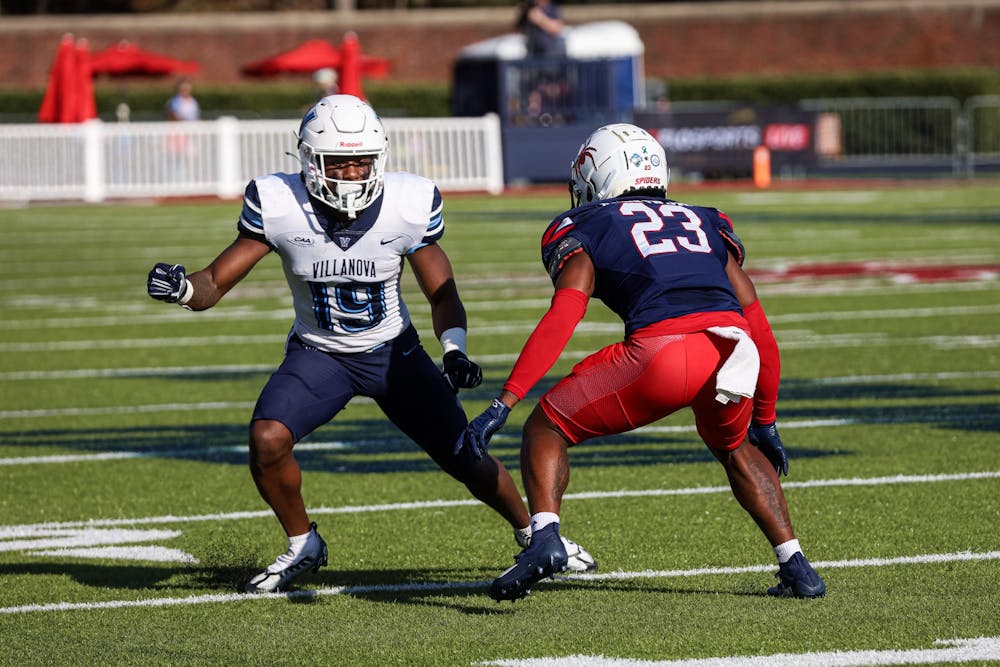 <p>Sophomore defensive back Angelo Rankin guards a Villanova University player at the Oct. 15 game in the Robins Stadium.</p>