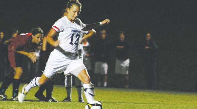 Senior Kelsey Rdzanek puts away a penalty kick to secure the win over Davidson.
