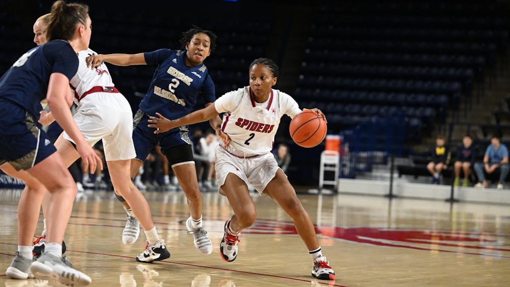Sophomore guard Sydney Boone blocks George Washington player during their game on Dec. 31 at the Robins Center. Photo courtesy of Richmond Athletics.&nbsp;