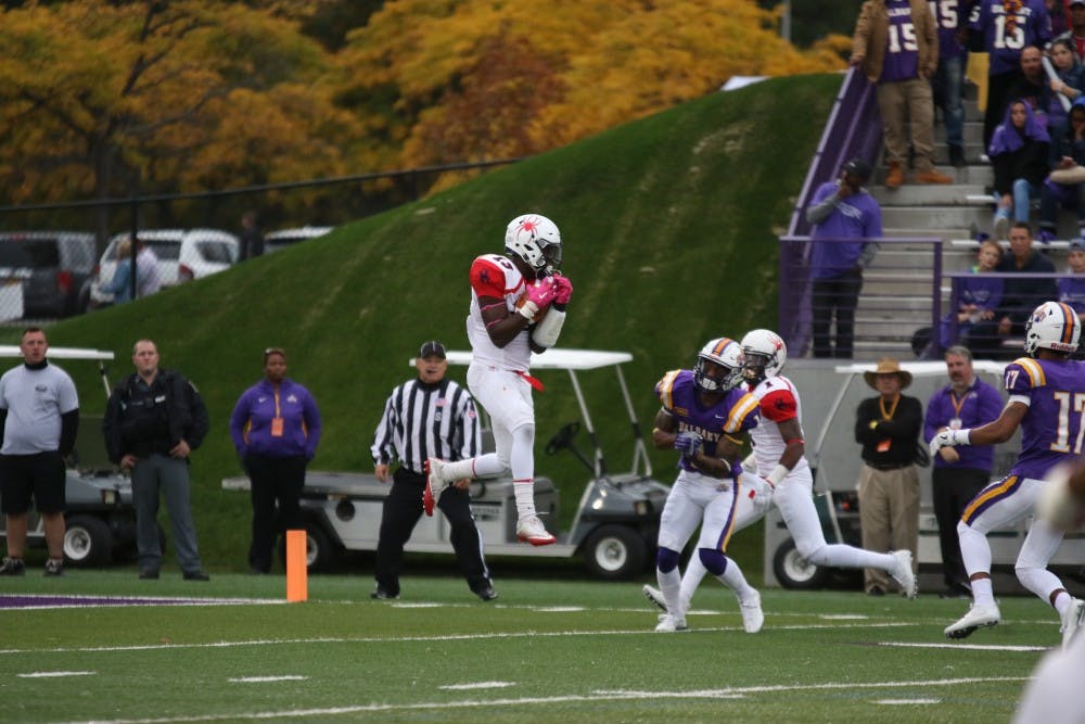 <p>David Jones jumps for an interception to end the first half against Albany last season. Jones suffered an injury during the game that would end his season.</p>