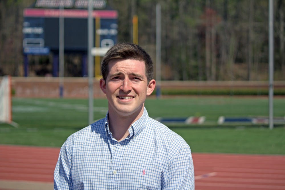 <p>Griffin Trau stands in front of E. Claiborne Robins Stadium where he played on UR's football team as kicker for four seasons.&nbsp;</p>