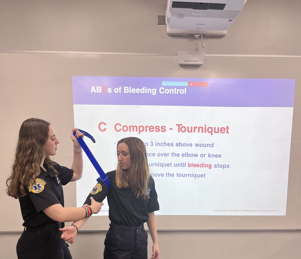 <p>Stop the Bleed trainers demonstrating how to use a tourniquet. Photo courtesy of Holly Wemple.&nbsp;</p>