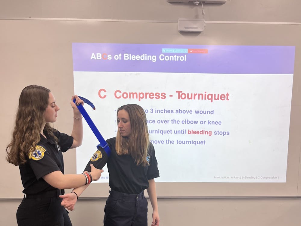 Stop the Bleed trainers demonstrating how to use a tourniquet. Photo courtesy of Holly Wemple.&nbsp;