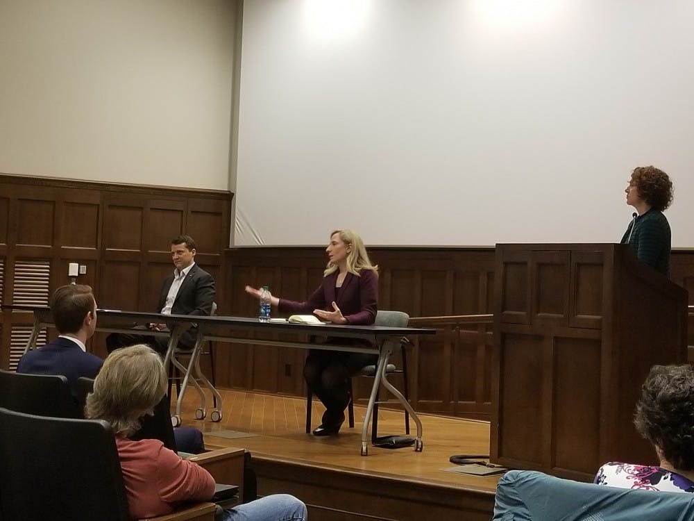 <p>Democratic congressional&nbsp;candidate Dan Ward, left, and professor Tracy Roof, right, listen to another Democratic congressional&nbsp;candidate,&nbsp;Abigail Spanberger, center, respond to a debate question in Ukrop Auditorium on April 2.&nbsp;</p>