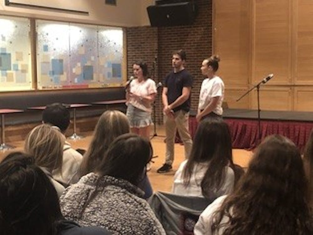 WCGA President Monica Stack (left), IFC President Dan Mahoney and CAPS intern Ally Charleston address students at the second annual In My Mind event.