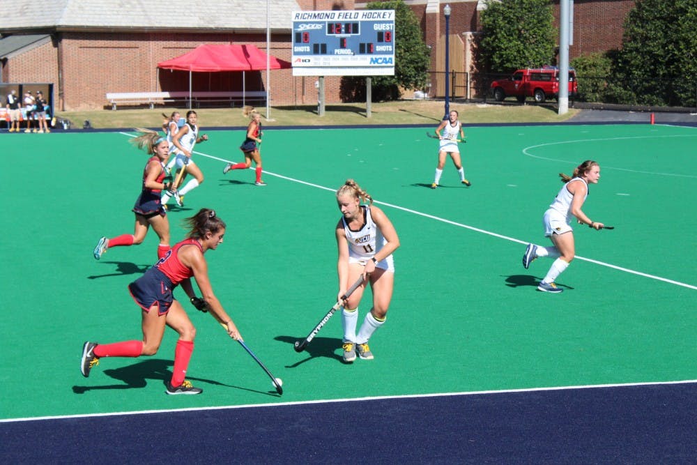 Senior Elise Zwicklbauer avoids VCU's defense during the field hockey game on Friday, Sept. 20, 2019.&nbsp;