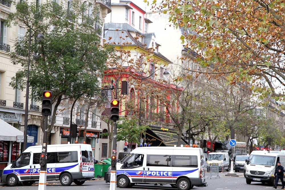 <p>Police outside of the Bataclan, the red concert hall where terrorists killed scores of people, after the attacks | Courtesy of Maya-Anaïs Yataghène/Wikimedia</p>