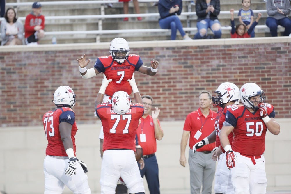 Dominant defensive play and a four-touchdown performance by quarterback Kevin Johnson (7) led the University of Richmond football team to a 52-7 victory over the Fordham Rams Saturday night in the Spiders’ home opener.