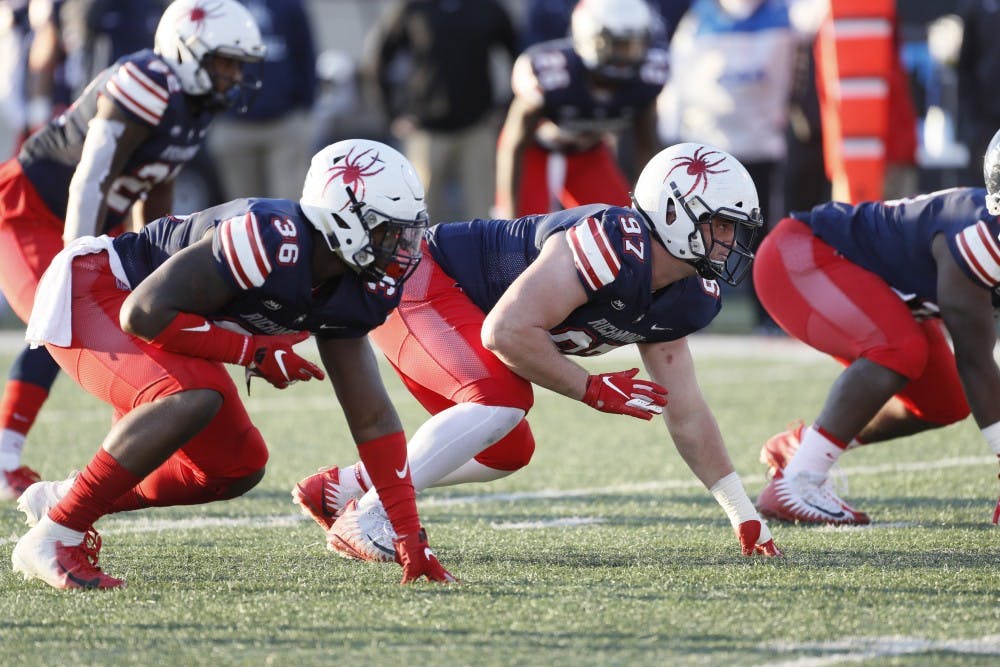 Junior Maurice Jackson (right) and redshirt senior Andrew Clyde during the football team's loss to the University of Maine on Saturday, Nov. 10. 