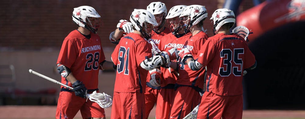 <p>Richmond lacrosse players celebrate after a goal.&nbsp;</p>