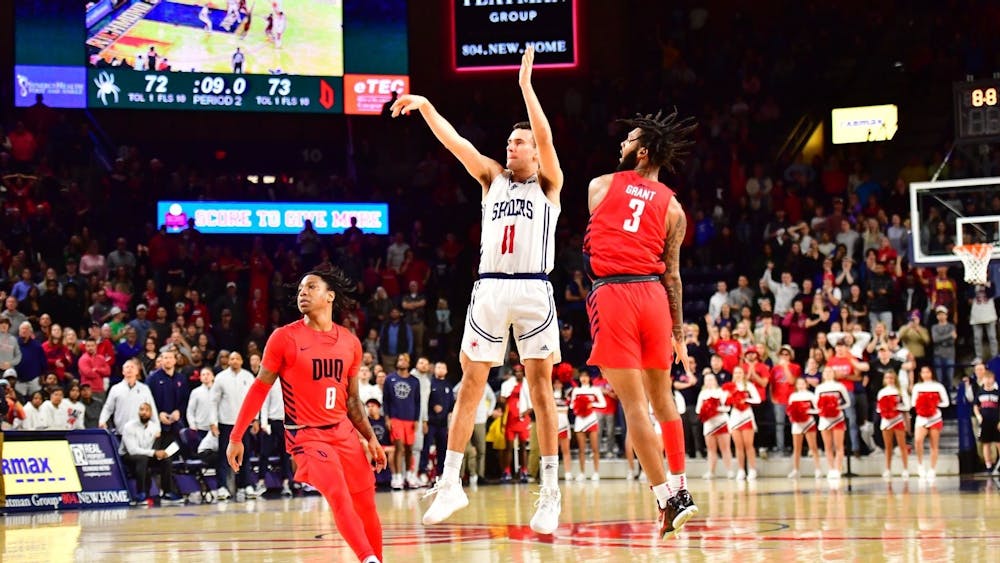 Sophomore guard Jason Roche shoots a 3-pointer during the game against Duquesne on Jan. 7 at the Robins Center. Photo courtesy of Richmond Athletics.&nbsp;