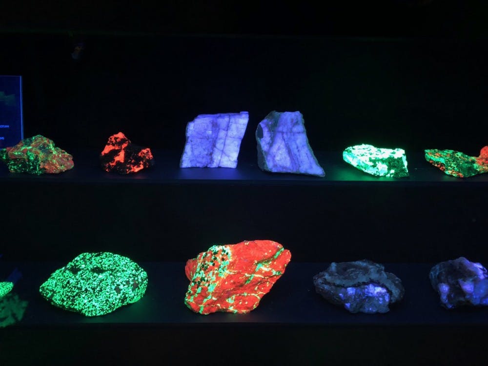 <p>A small side room in the Lora Robins Gallery features fluorescent rock displays. To fully witness the rocks' unique colors, guests can hit a green button on the wall that dims the regular lights and exposes the different rocks to a sequence of ultraviolet lights, illuminating bright and natural neon shades of green, red, blue and purple.</p>
