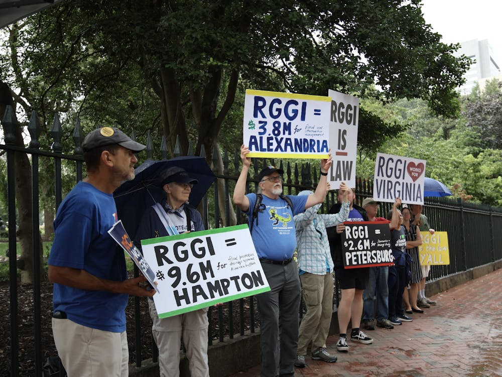 <p>Climate activists gather on 202 N 9th St to condemn Youngkin's decision to repeal RGGI Aug. 28.&nbsp;</p>