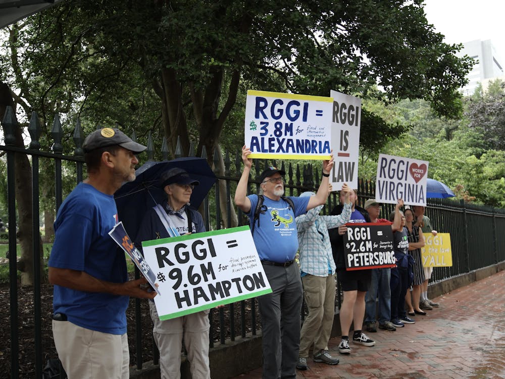 Climate activists gather on 202 N 9th St to condemn Youngkin's decision to repeal RGGI Aug. 28. 