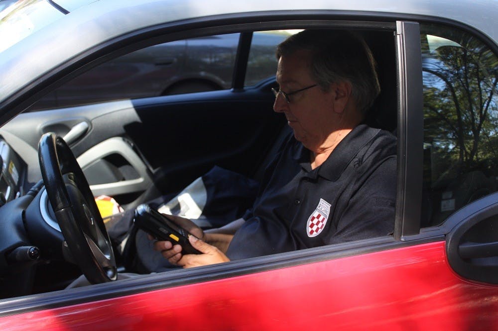 <p>Bill Rawluk, Richmond's parking enforcement specialist, has been writing parking tickets for 14 years at the university. Few know him, and many resent him. </p>