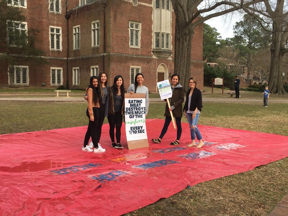 <p>Members of Spiders CARE,&nbsp;a new organization on campus that advocates for animal rights, pose outside of the library to spread awareness about plant-based diets. Photo courtesy of Diana Nguyen.&nbsp;</p>