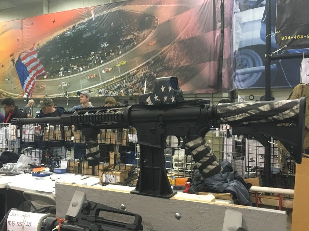 An assault rifle on display with American Flag and Constitutional preamble decal.&nbsp;