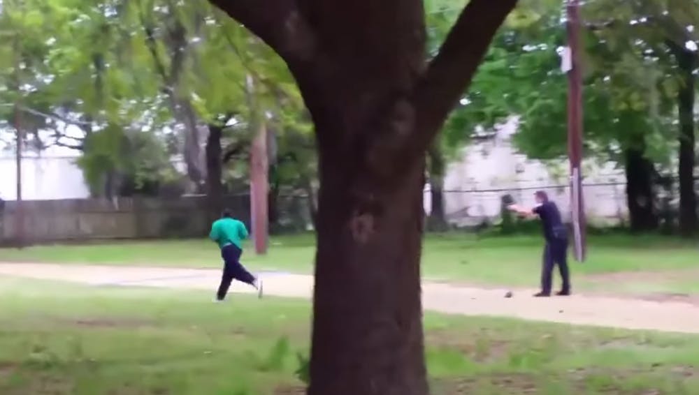 <p>A screen shot from the video of a civilian who captured the Slager shooting the fleeing Scott. Courtesy of The Lad Buzz/Creative Commons.</p>