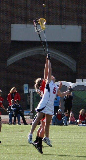 Caitlin Fifield wins a face off